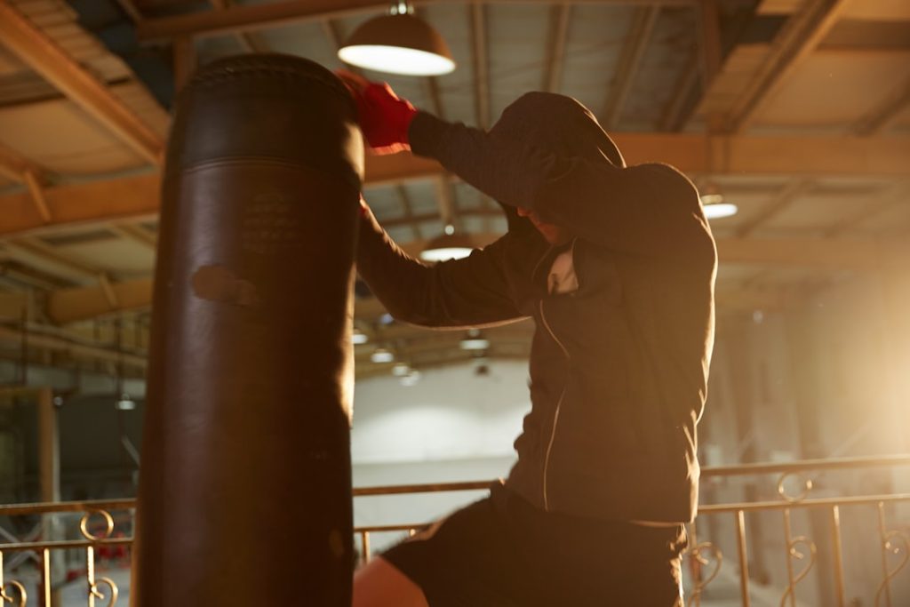 man-kicking-the-heavy-bag-jus9gbnqhyq